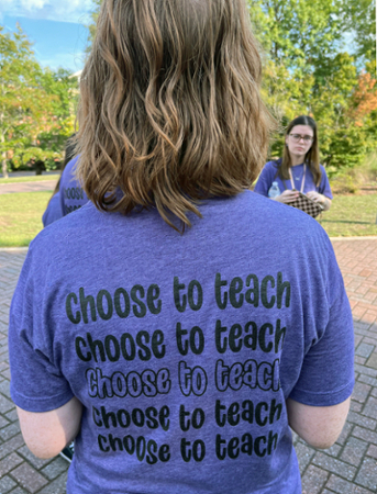 Purple "Choose to Teach" t-shirt. 